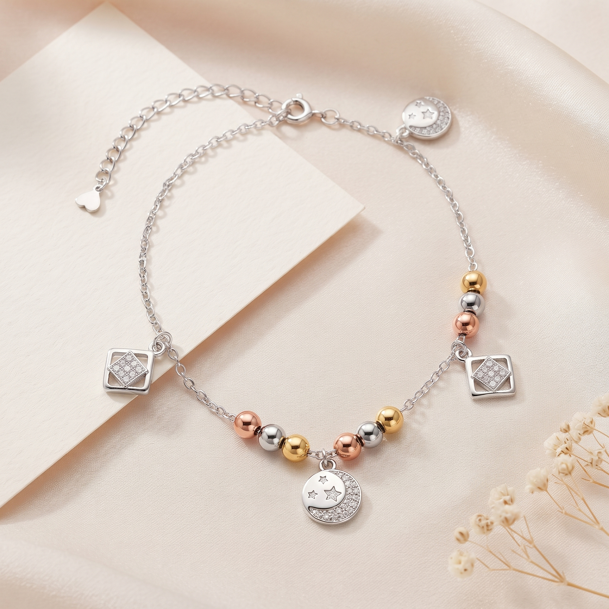 Silvme tri-tone geometric & star 925 silver anklet with tri-tone beads with geometric and star charms, full-length view