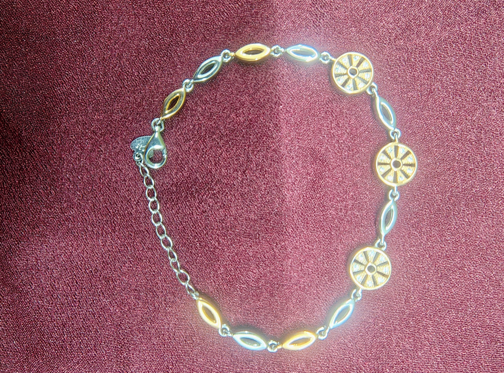 Silver horseshoe charm bracelet close-up detail