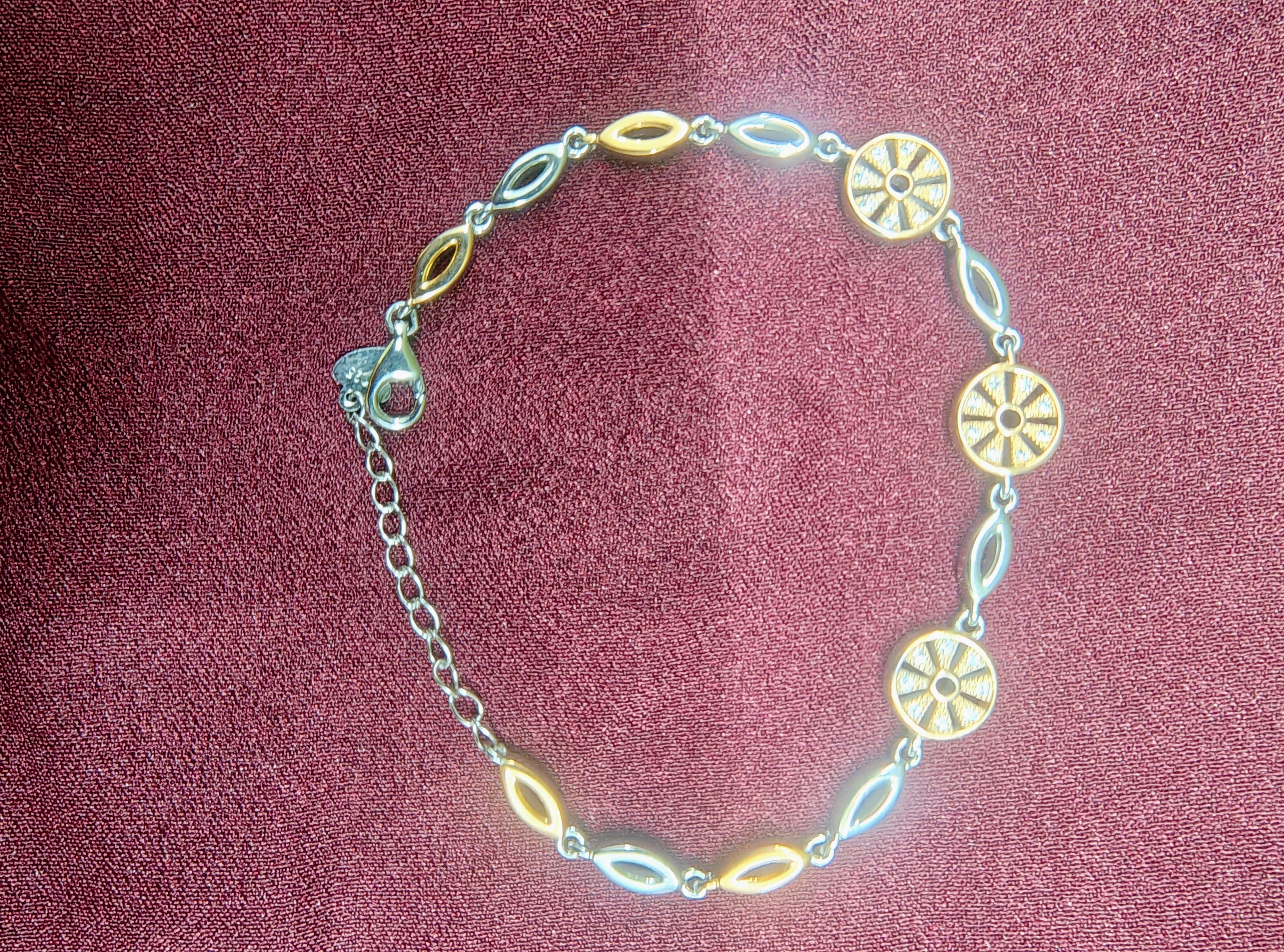 Silver horseshoe charm bracelet close-up detail