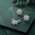 Silvme 925 silver sparkling cubic zirconia pendant necklace and stud earrings with cubic zirconia, side profile view