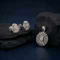 Starburst Medallion 925 sterling silver pendant and stud earrings jewellery set with cubic zirconia by Silvme â€” angled studio view