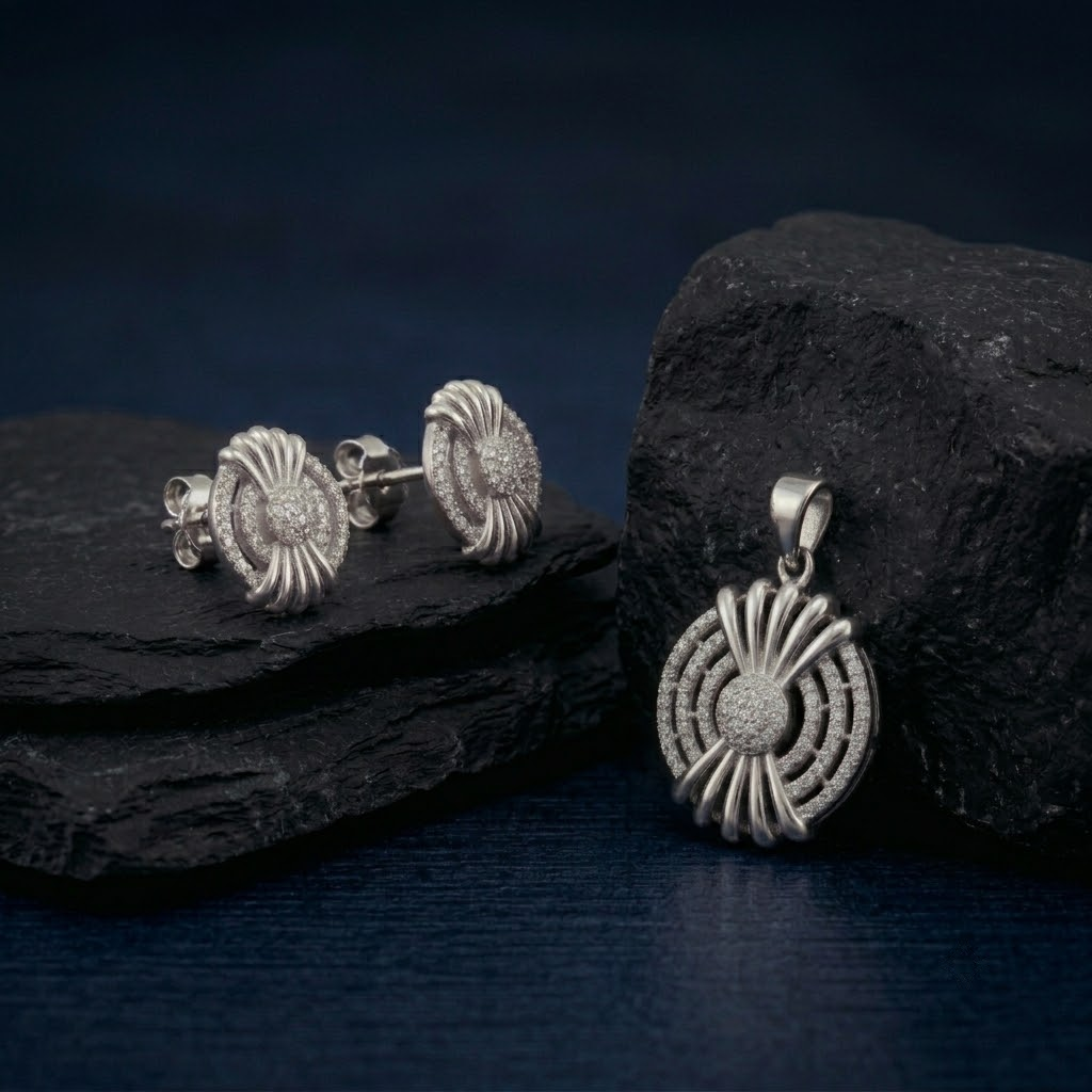 Starburst Medallion 925 sterling silver pendant and stud earrings jewellery set with cubic zirconia by Silvme â€” angled studio view