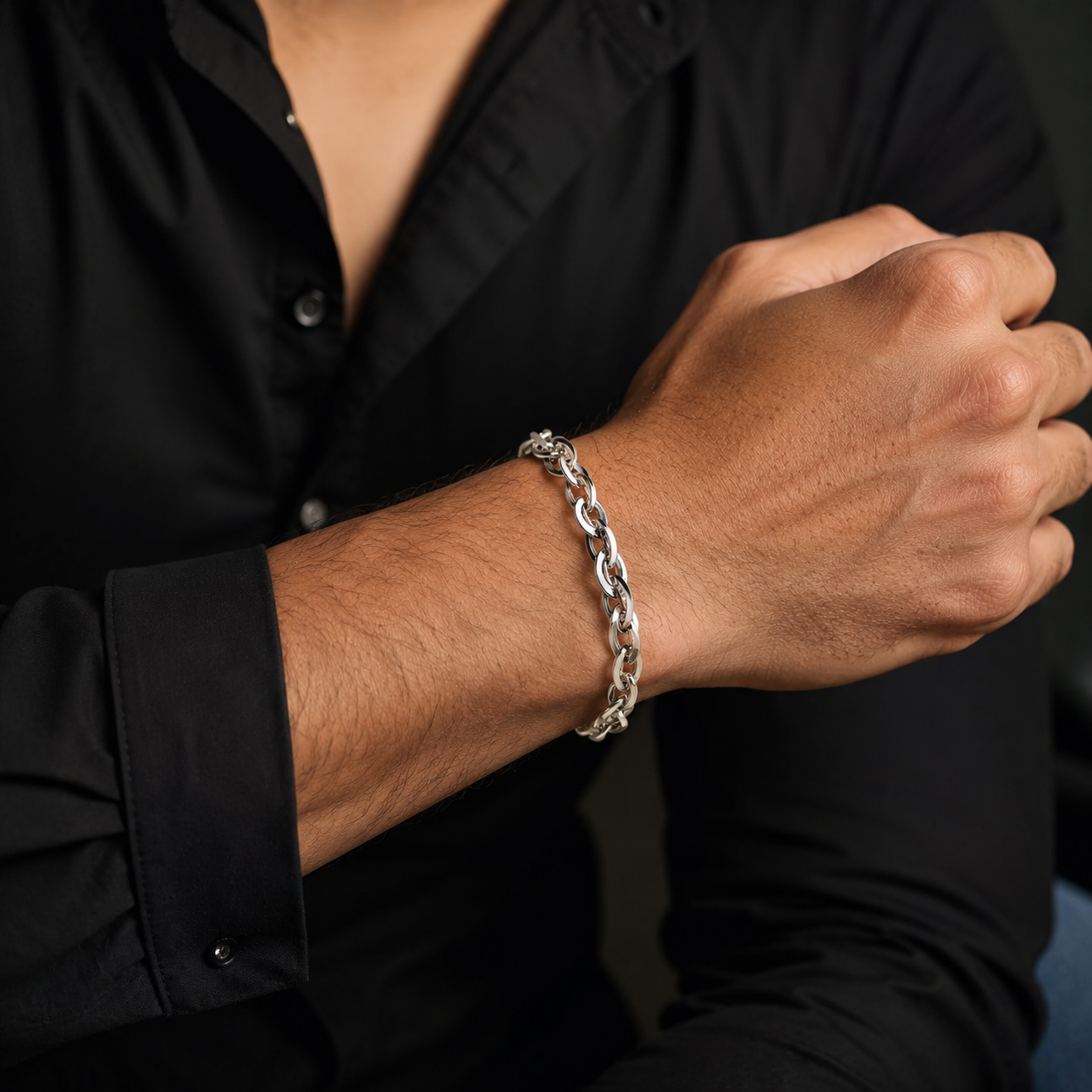 Full length of the interlocked twist link bracelet showing its polished silver-tone finish