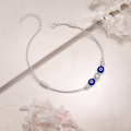Silvme blue evil eye snake chain 925 silver anklet with twin blue evil-eye beads on a snake chain, full-length view