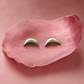 Crescent 925 silver stud earrings for women, daily wear, styled backdrop shot