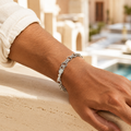 Full length of the fine rolo chain bracelet showing its polished silver-tone finish