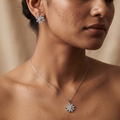 Blossom Flower 925 sterling silver pendant and stud earrings jewellery set with cubic zirconia by Silvme â€” styled lifestyle image
