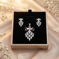 Kite Cluster 925 sterling silver pendant necklace and drop earrings jewellery set with cubic zirconia by Silvme â€” styled lifestyle image