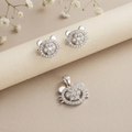 Cat face silver set styled on a neutral backdrop showing the ear and whisker detail