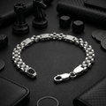 Link pattern and surface detail across the engraved panel link bracelet by Silvme