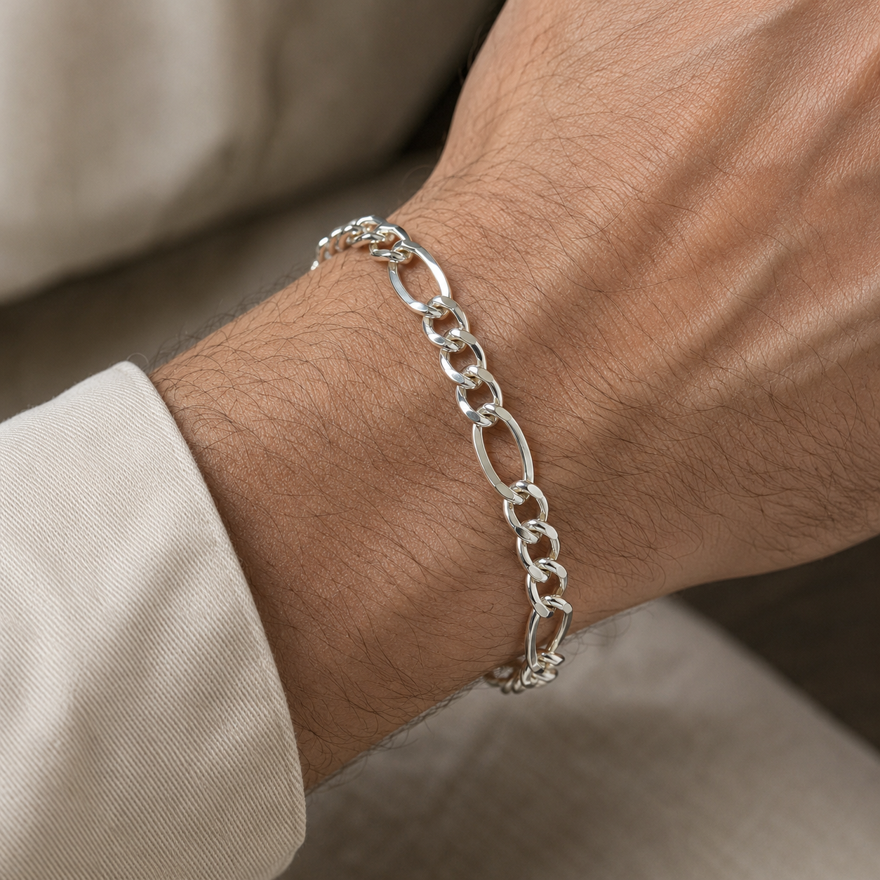 Full length of the figaro chain bracelet showing its polished silver-tone finish