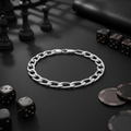 The curb chain bracelet for men shown against a plain studio background
