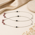 Close-up of red evil-eye and black beads on a snake chain on the Silvme 925 sterling silver evil eye & black bead anklet