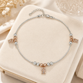 Clasp and adjustable extension-chain detail of the Silvme rose-gold CZ bell charm silver anklet