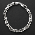 Close-up of heavy interlocking links with a twisted, rope-like build on the Silvme chunky twisted link bracelet