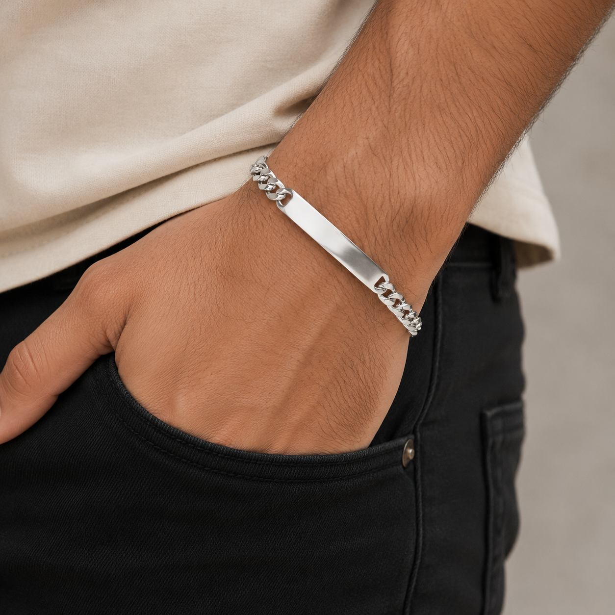 The curb chain id bracelet for men shown against a plain studio background