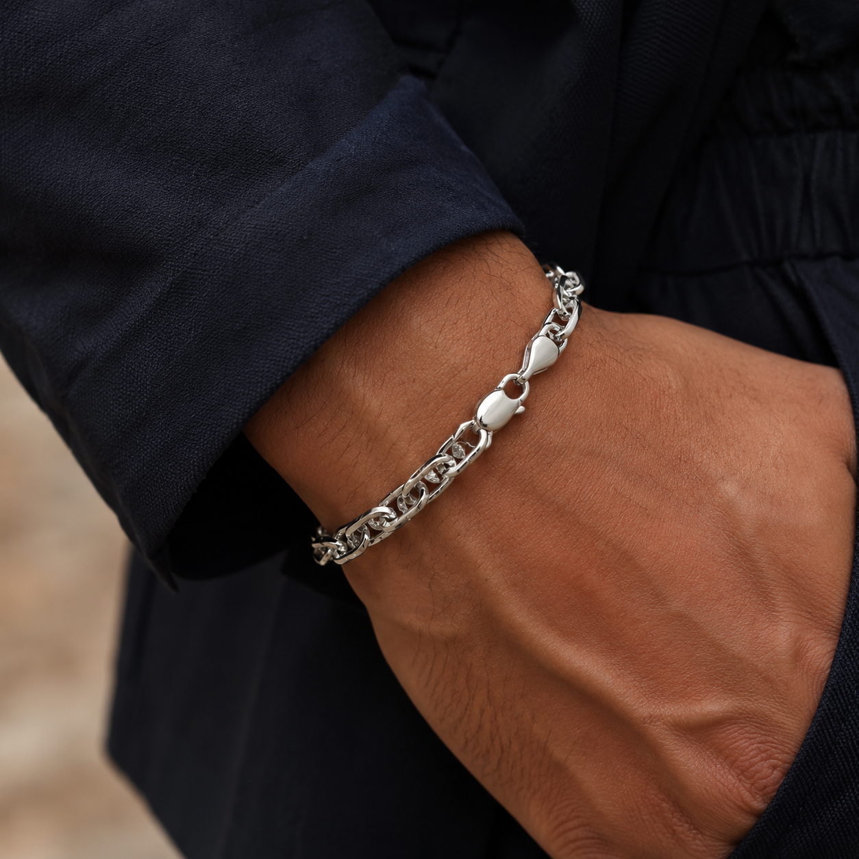 Full length of the chunky twisted link bracelet showing its polished silver-tone finish