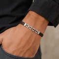 Full length of the braided cord bracelet with silver-tone bar showing its brown cord with silver-tone fittings finish