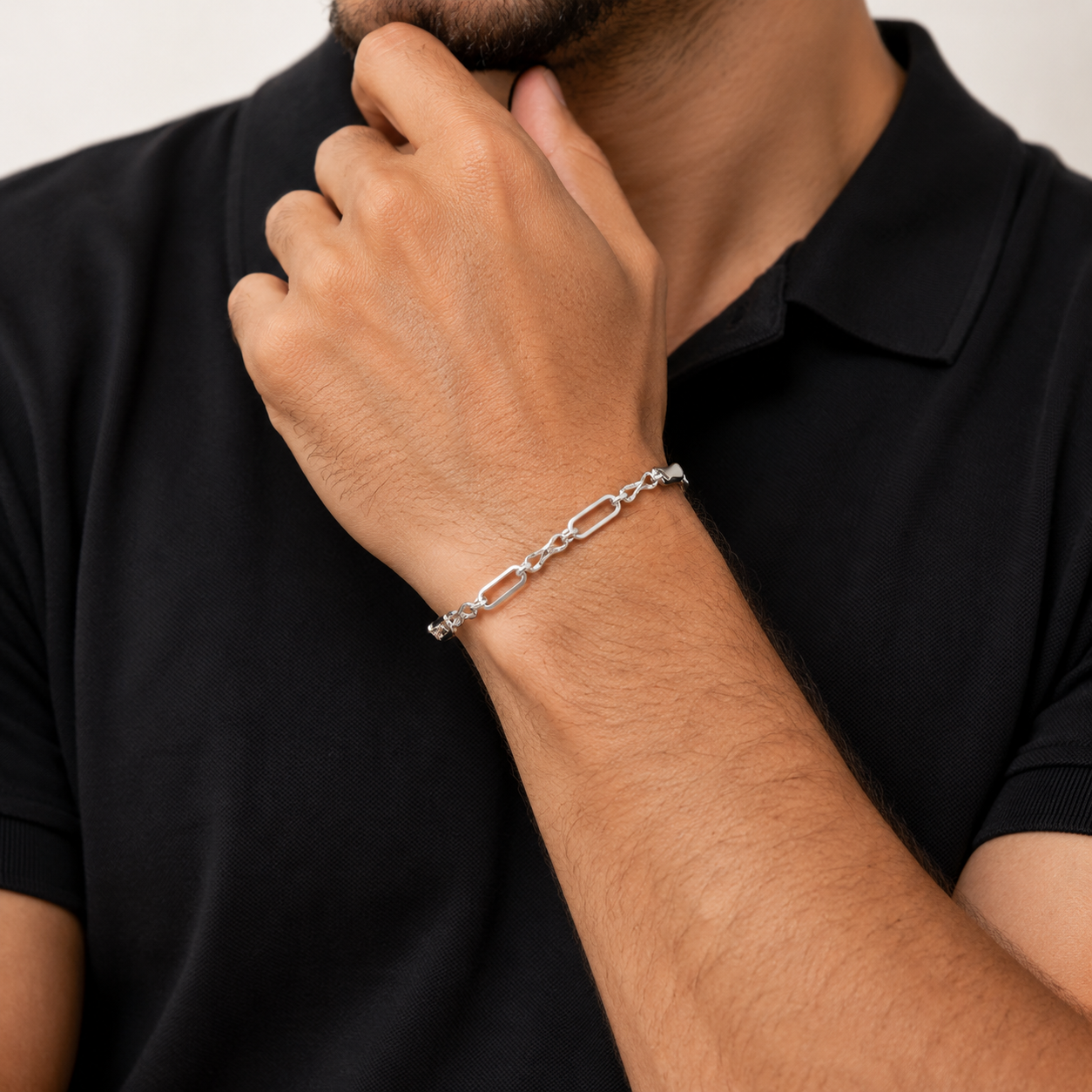 Full length of the long and short link bracelet showing its polished silver-tone finish