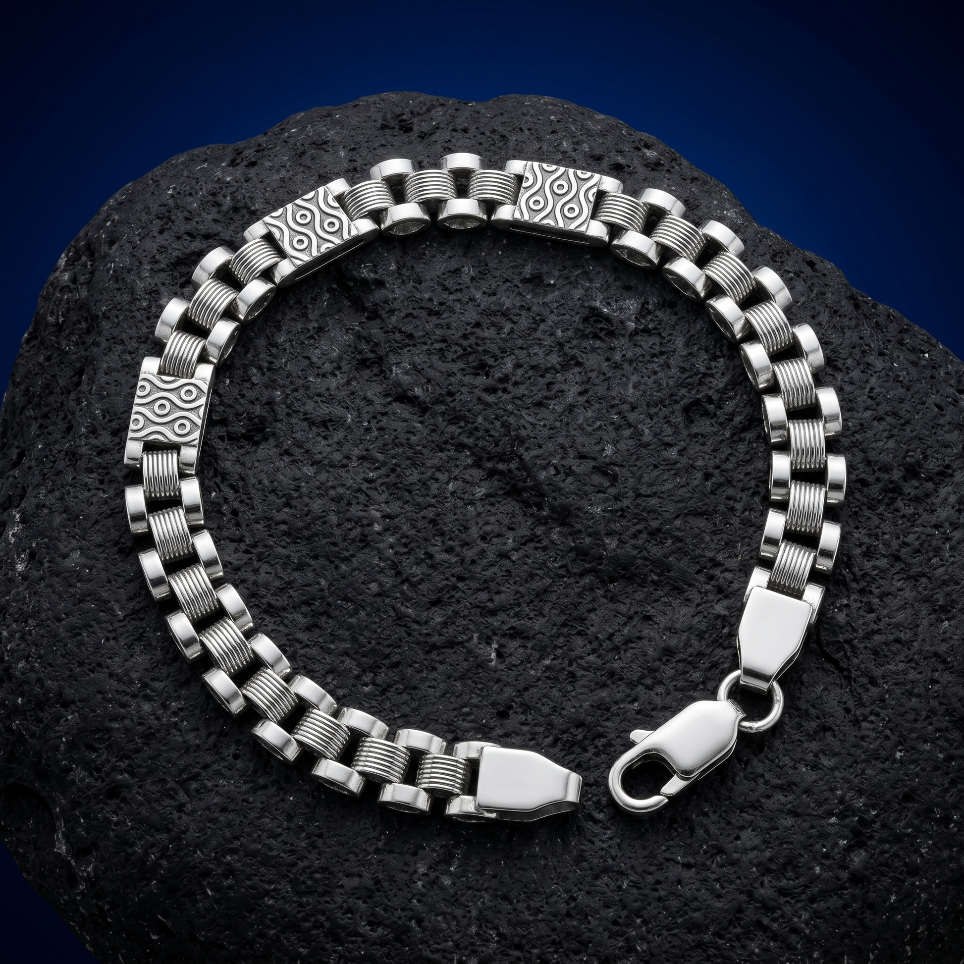The engraved panel link bracelet for men shown against a plain studio background
