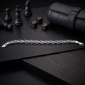 Close-up of a fine rolo chain kept deliberately understated on the Silvme fine rolo chain bracelet