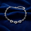 Heart Link design detail on the Silvme Heart Link Bracelet, crafted in polished 925 sterling silver