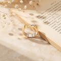 Silvme two-tone gold and silver silver ring for women worn paired with minimal silver bands on the hand