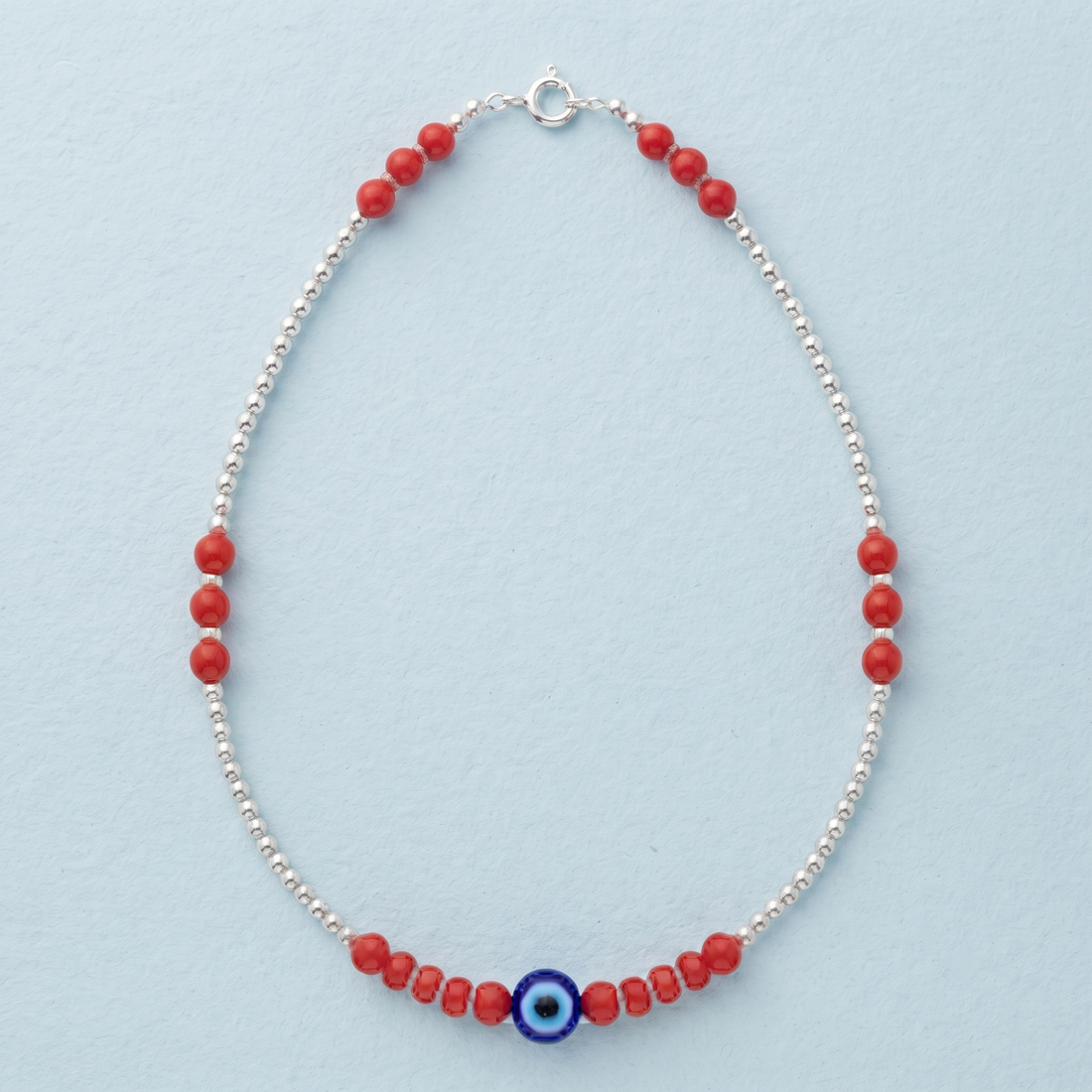 Silvme 925 sterling silver red bead evil eye anklet with red beads and a blue evil-eye charm, white background full view