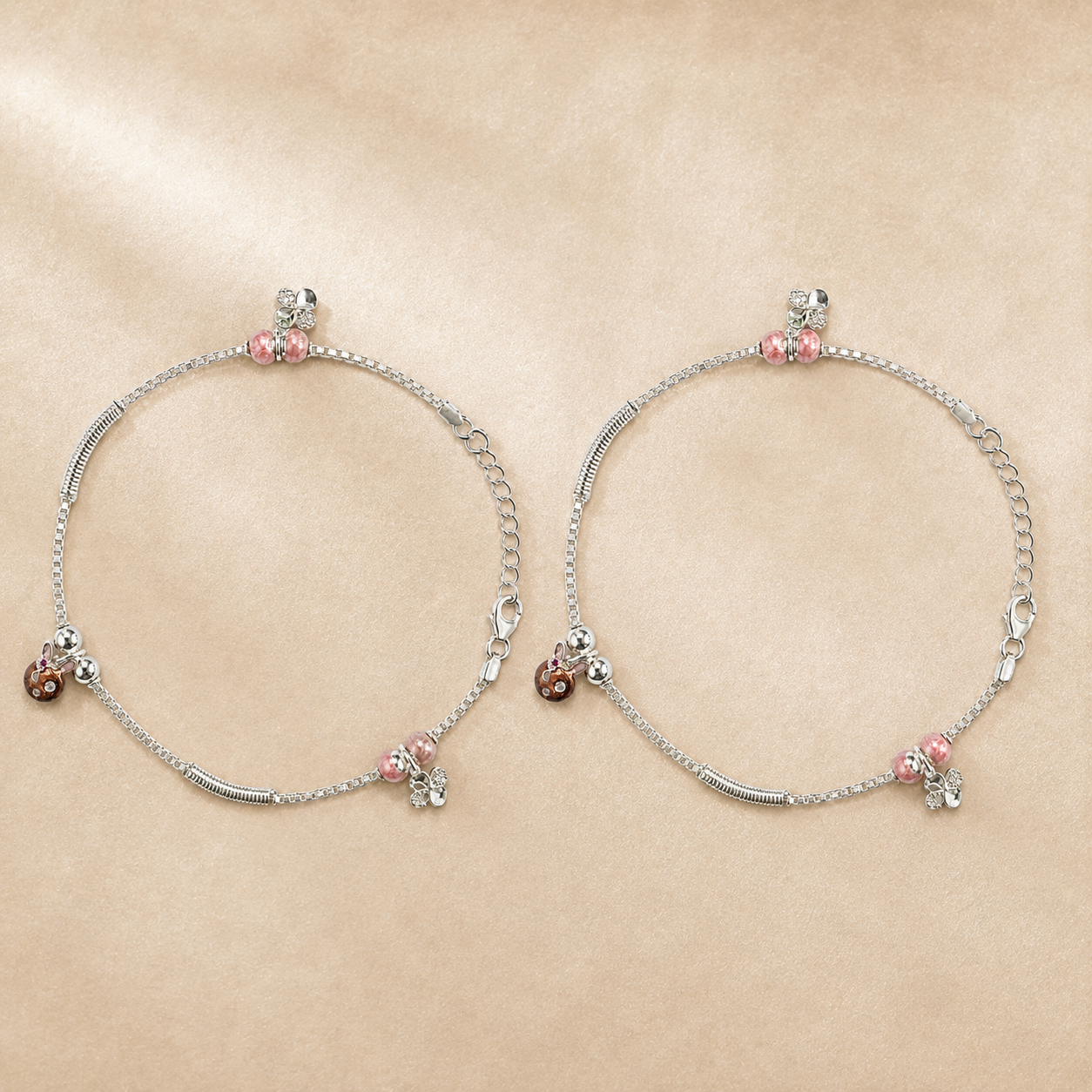 Close-up of pink beads and rose-gold floral CZ charms on the Silvme 925 sterling silver pink bead & rose-gold floral anklet