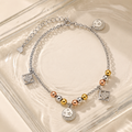 Charm, bead and chain detail on the Silvme tri-tone geometric & star 925 silver anklet payal