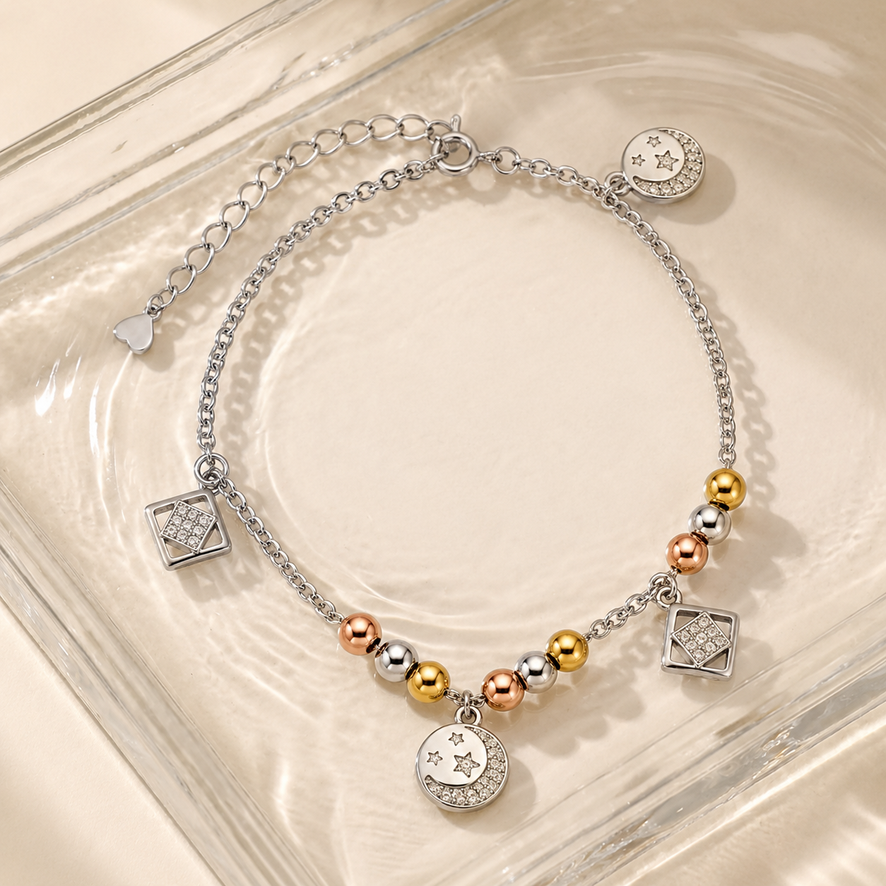 Charm, bead and chain detail on the Silvme tri-tone geometric & star 925 silver anklet payal