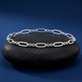 Link pattern and surface detail across the oval and bead link bracelet by Silvme