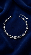 Heart Link design detail on the Silvme Heart Link Charm Bracelet, crafted in polished 925 sterling silver