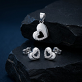 Silvme pure 925 sterling silver open heart pendant and stud earrings set with cubic zirconia, side profile view