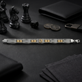 The two-tone bar link bracelet for men shown against a plain studio background