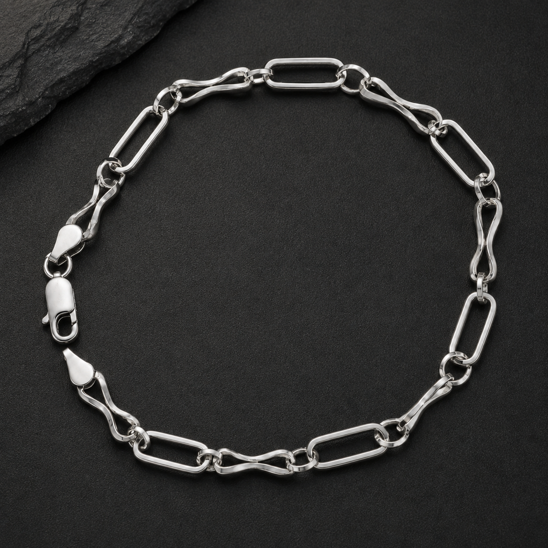 Silvme 925 sterling silver long and short link bracelet for men shaped into an oval on a white background