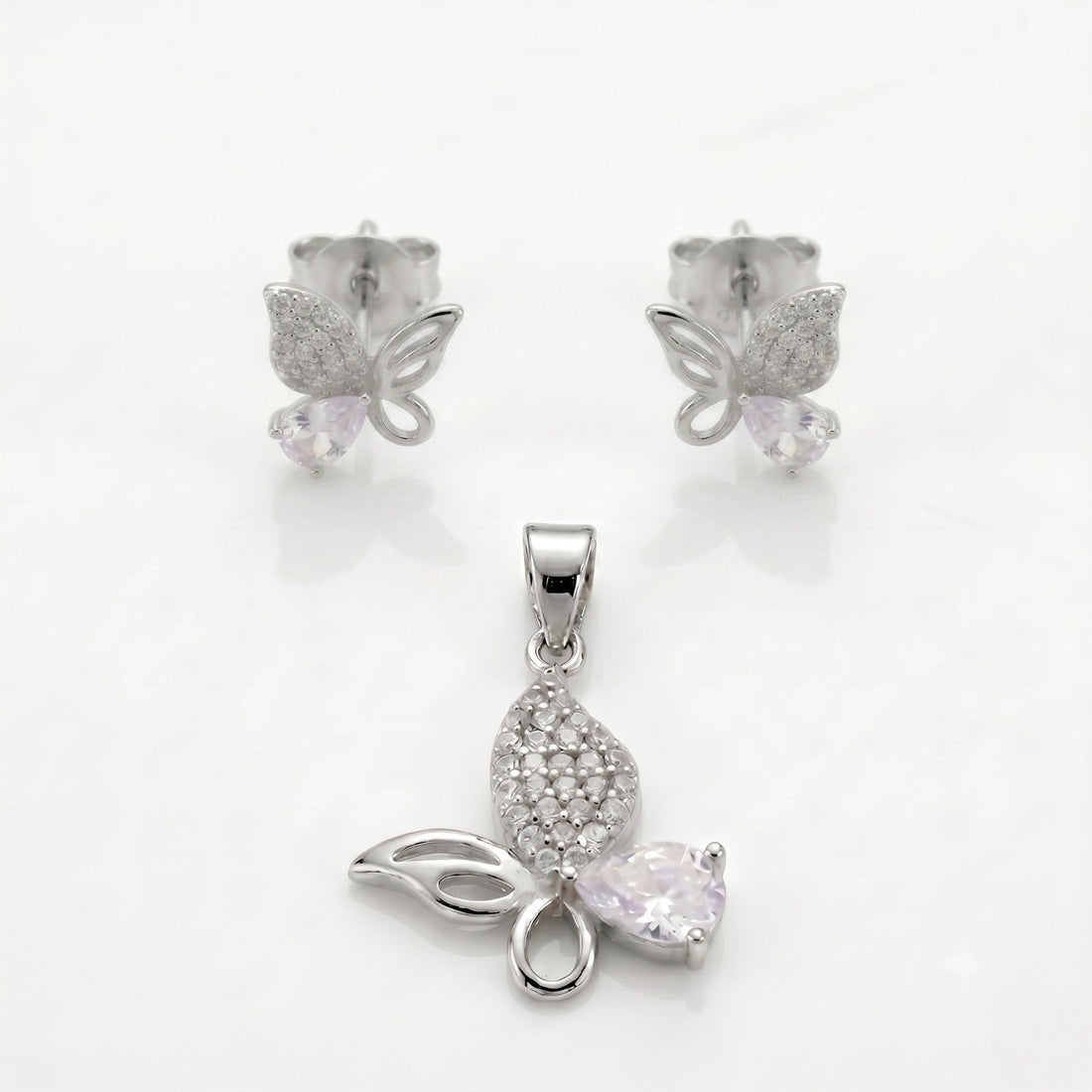 Silvme pure 925 sterling silver pink butterfly pendant and stud earrings set with pink cubic zirconia, front view on white background