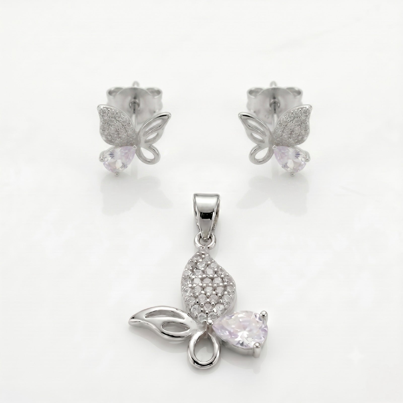 Silvme pure 925 sterling silver pink butterfly pendant and stud earrings set with pink cubic zirconia, front view on white background