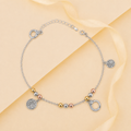 Charm, bead and chain detail on the Silvme tree of life tri-tone charm 925 silver anklet payal
