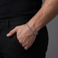 Close-up of tightly twisted links that catch light along the whole length on the Silvme twisted rope chain bracelet