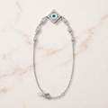 Charm, bead and chain detail on the Silvme rhombus CZ evil eye 925 silver anklet payal