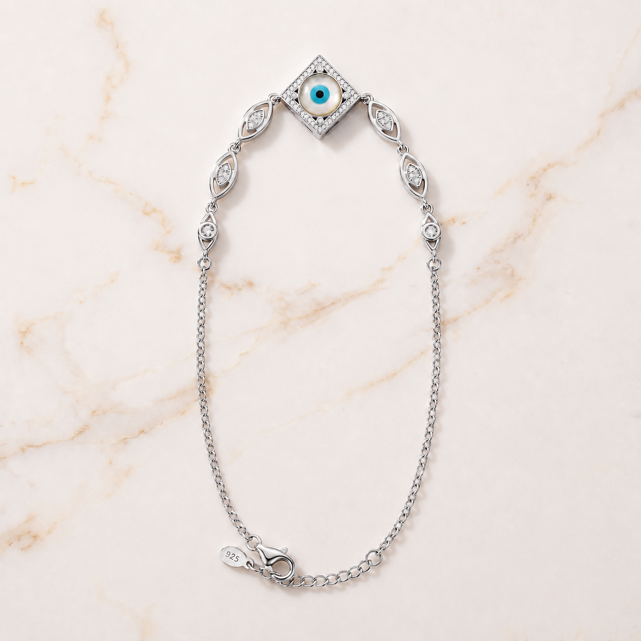 Charm, bead and chain detail on the Silvme rhombus CZ evil eye 925 silver anklet payal