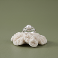 Close-up of the single round white pearl on a split-shank band, Silvme 925 sterling silver pearl solitaire ring for women