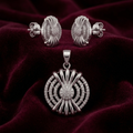 Silvme 925 silver starburst medallion pendant and stud earrings with cubic zirconia, close-up detail