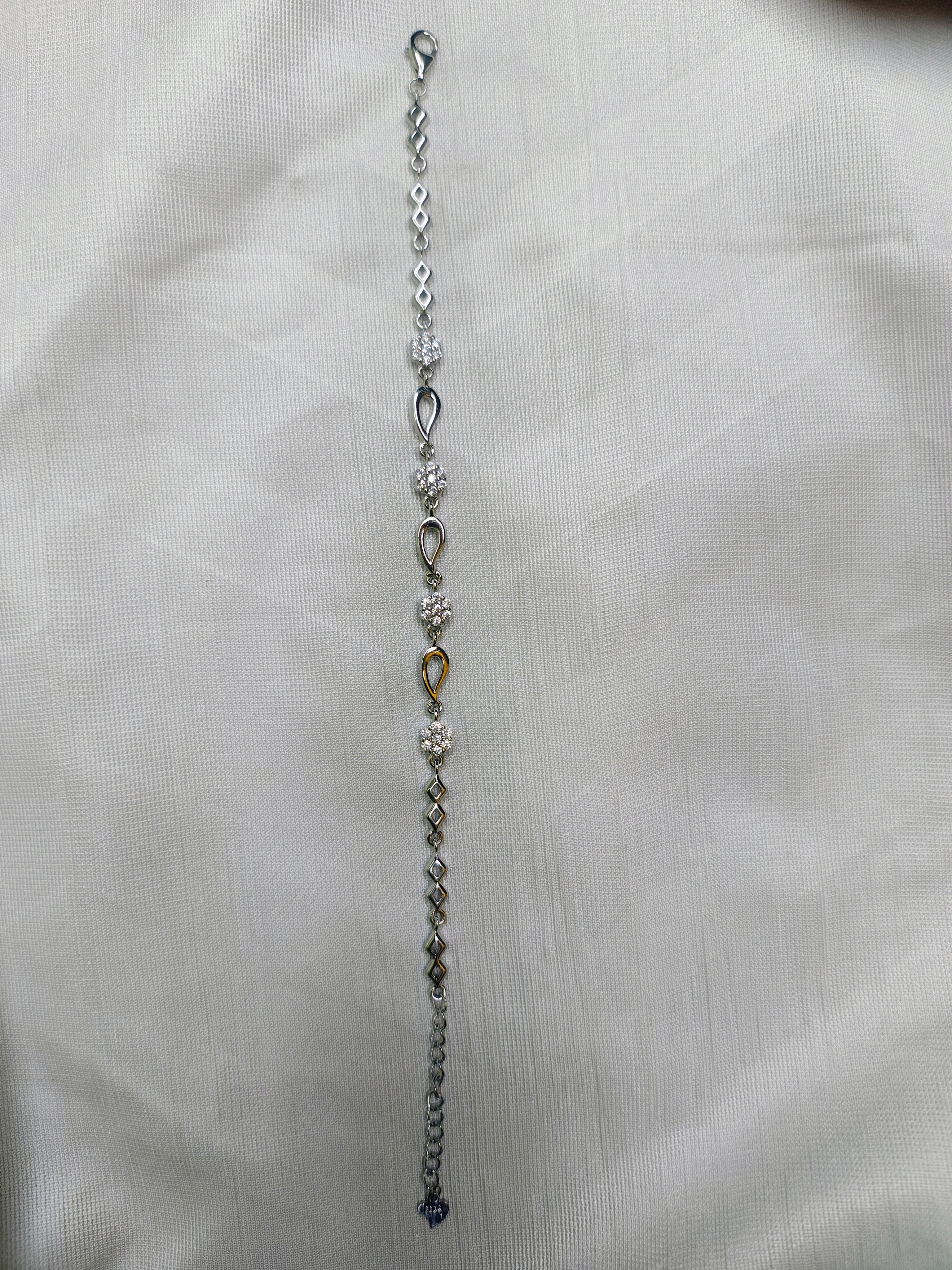 Silver infinity link bracelet close-up polish