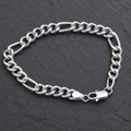 Close-up of flat Figaro links with a broad, mirror-bright face on the Silvme polished figaro chain bracelet