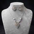 Silvme pure 925 sterling silver cubic zirconia pendant necklace and stud earrings set with cubic zirconia, detail sparkle close-up