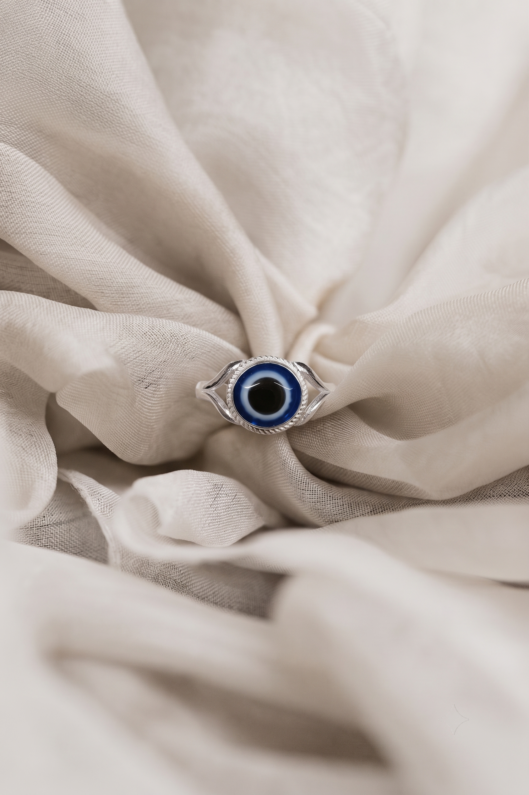Close-up of the small blue evil eye motif on a slim band, Silvme 925 sterling silver dainty evil eye ring for women