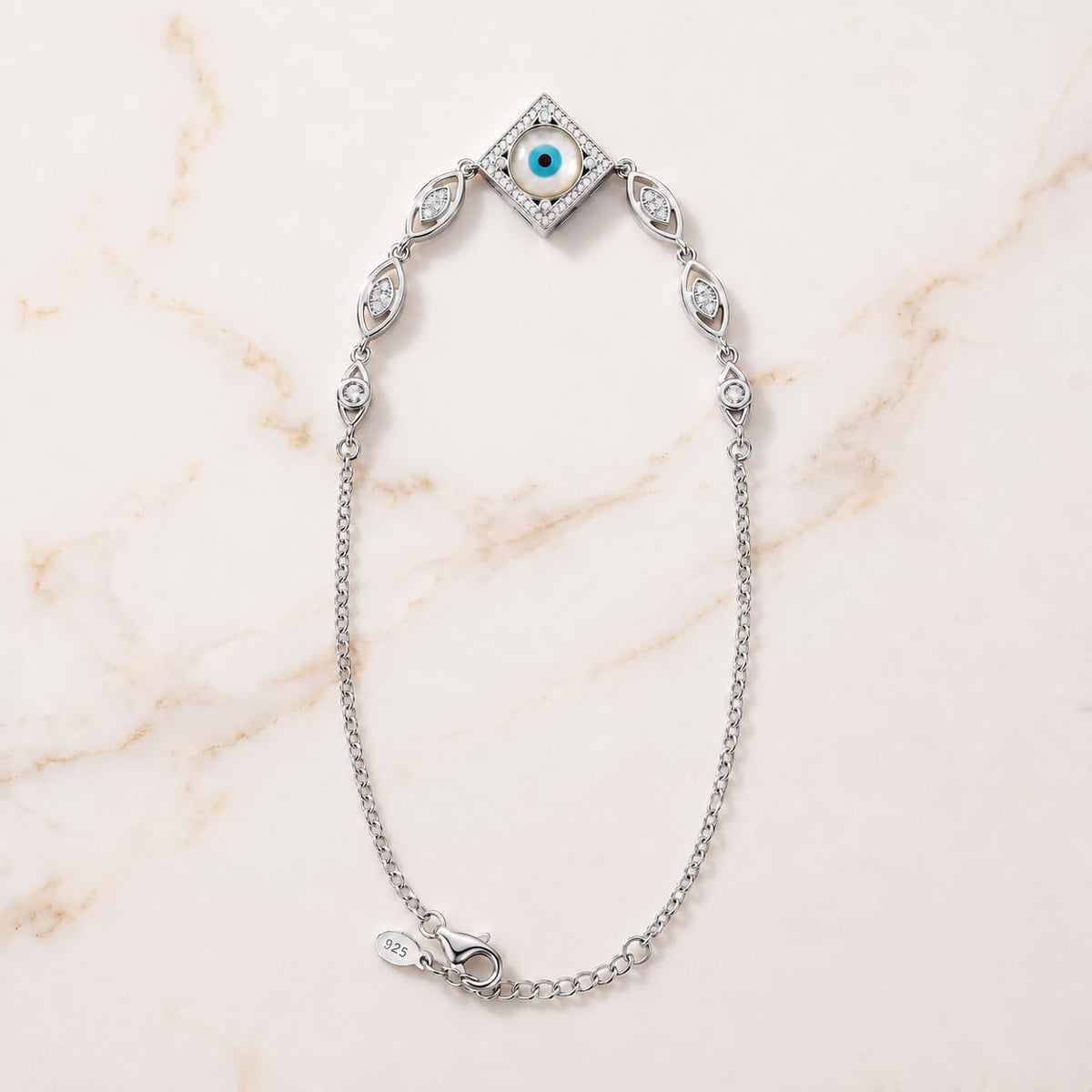 Charm, bead and chain detail on the Silvme rhombus CZ evil eye 925 silver anklet payal