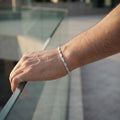 The flat mariner link bracelet for men shown against a plain studio background